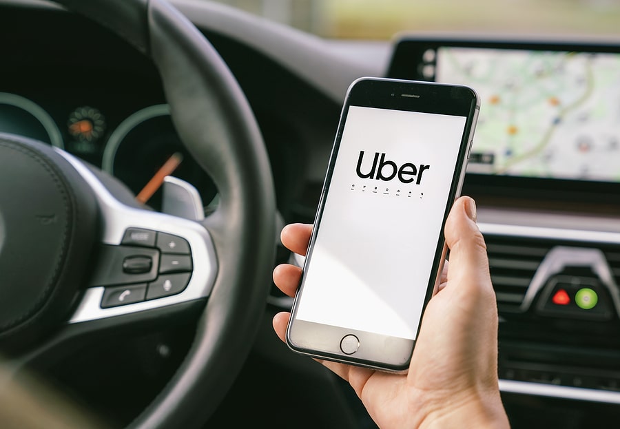 Uber Driver Holding Smartphone In Car Uber Is An American Compa